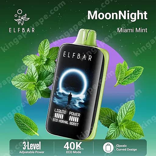 Vape jetable Elfbar Moonnight Miami Mint avec un corps noir brillant, un embout vert citron, un graphique de lune circulaire brillant sur l'écran, entouré de feuilles de menthe sur un fond dégradé vert à violet.