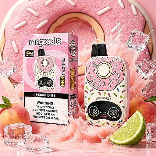 Pink Donut-Shaped Vape Device With Sprinkles And A Cream Center Sits Beside Its Matching Pink Box Labeled Mr.goodie Peach Lime, Surrounded By Ice Cubes, A Lime Wedge And Peaches Against A Pink Donut-Themed Backdrop.