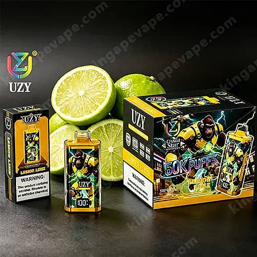 Boîtes de vape jetables Uzy citron-lime et une petite bouteille disposée avec des moitiés de citron vert en arrière-plan, comportant un personnage musclé et l'étiquette ' 60K Puffs ' sur l'emballage.