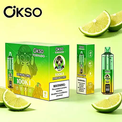 Helder groen-gele weergave van vape-producten met citroen-limoensmaak, met sets in dozen en een fles, met partjes limoen op de achtergrond.