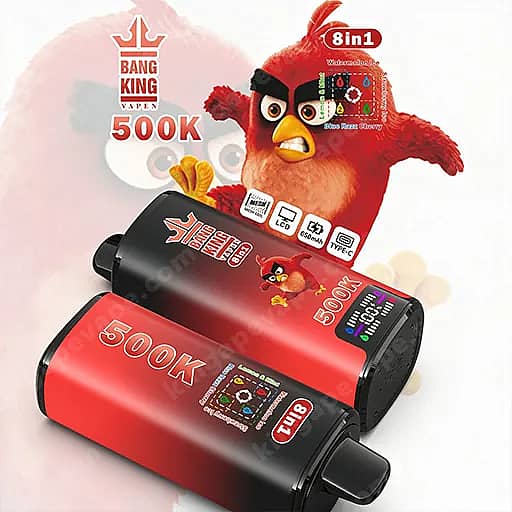 An Angry Birds–Style Red Bird Figure Stands Behind Two Red And Black Bang King Vape 500K Cylindrical Devices, With An 8In1 Label And 500K Branding Visible.