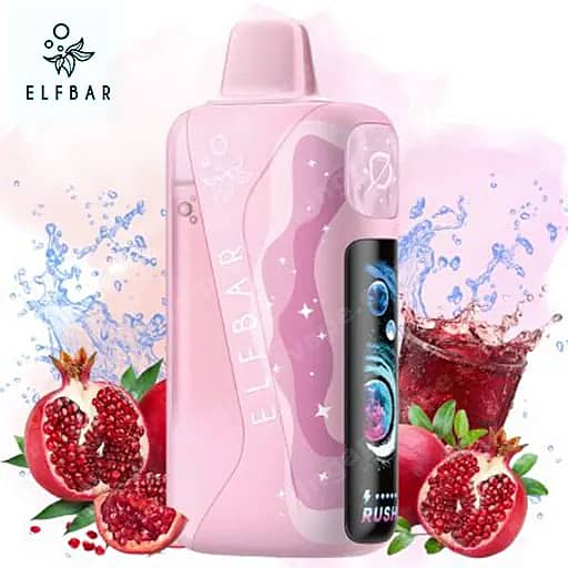 Elf Bar Lush King Pro 40000 Puffs Vape | Dual Mesh &Amp; Smart Screen Eu Warehouse 10 Pink Elf Bar Disposable Vape With A Curved Light-Pink Body And A Black Side Panel Stands Upright Beside Whole And Halved Pomegranates And A Glass Of Red Juice With Ice Against A Pale Pink Background.