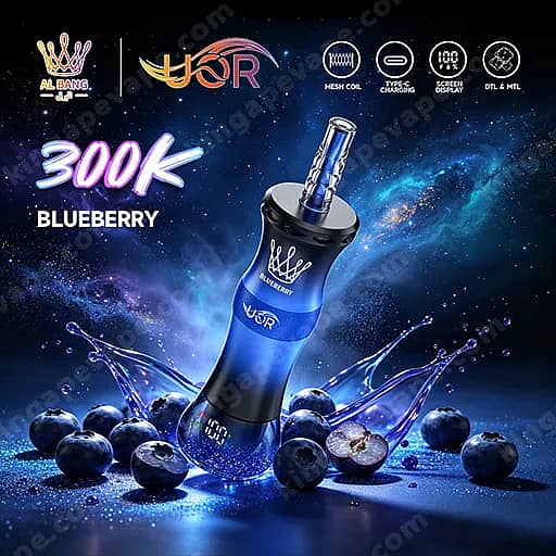 Uor Al Bang 300K Puffs Disposable Vape | Dual Mode Mtl &Amp; Dtl 11 Blue And Black 300K Blueberry Vaping Device With A Clear Blue Mouthpiece, Standing Upright Among Splashes Of Blue Liquid And Scattered Blueberries, Set Against A Cosmic Blue Background.