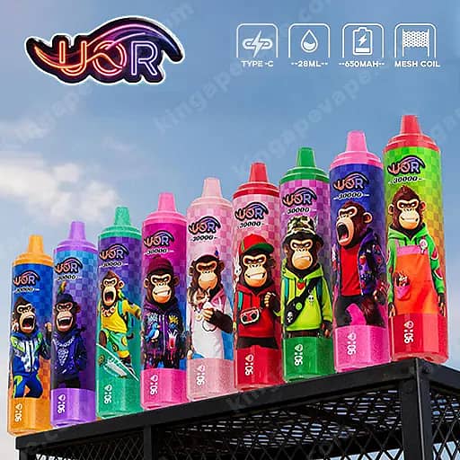 Uor Tornado 30000 Puffs Led Display 30K Vape Pen 2 Row Of Colorful Gorilla-Themed Vape Bottles Lined Up On A Black Railing Against A Bright Blue Sky.